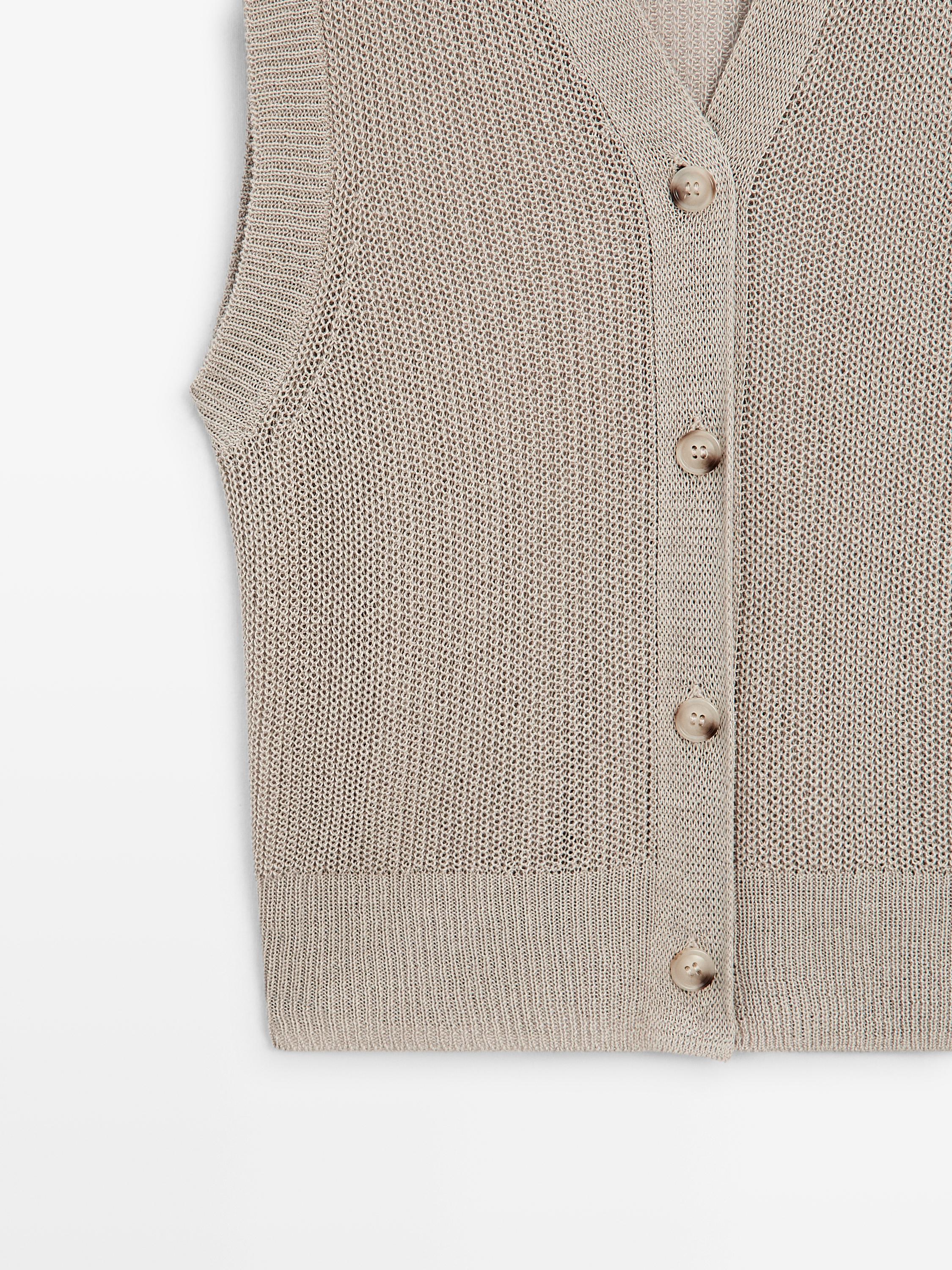 Knit vest with a high neck